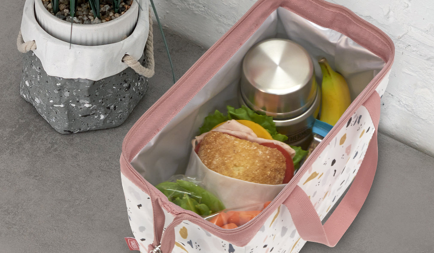 Adult lunch box with food inside.