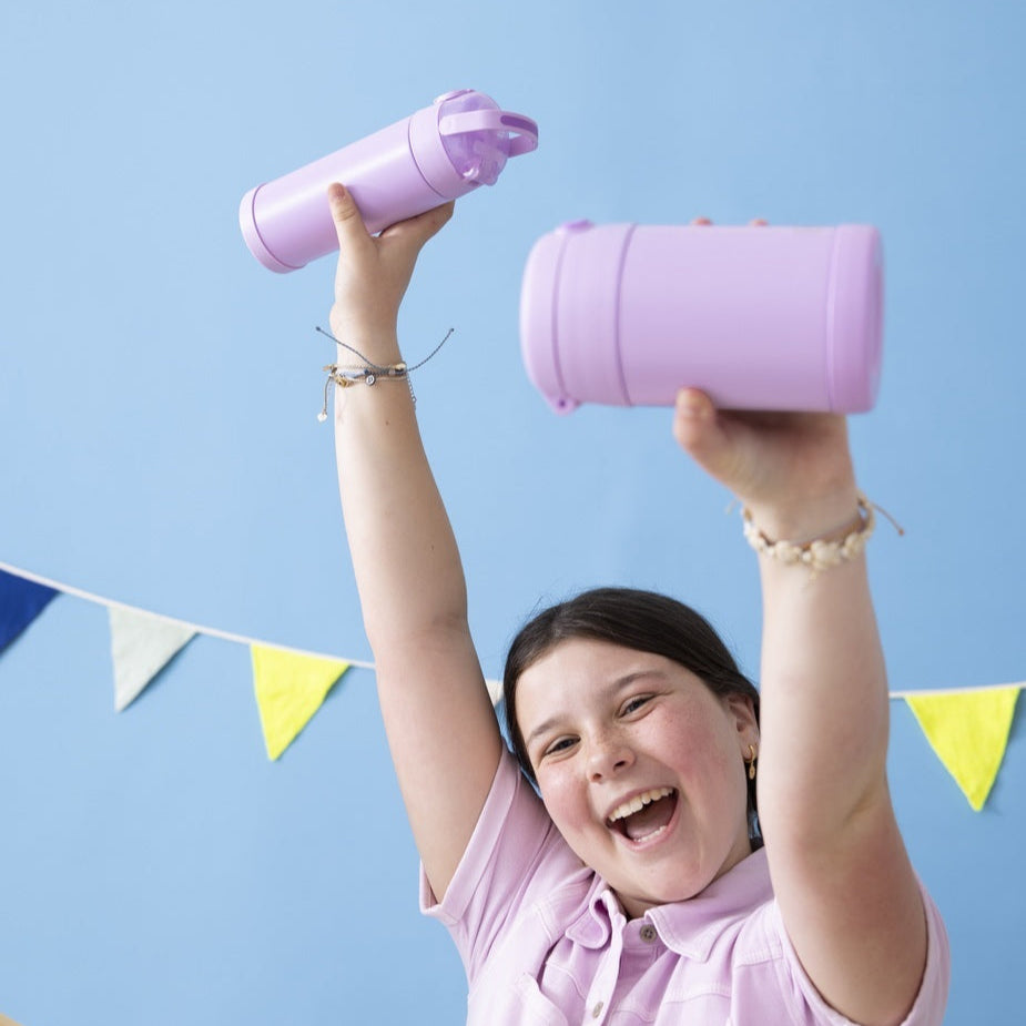 Kid holding Thermos FUNtainer 16oz Water Bottle and Food Jar in Neon Purple.