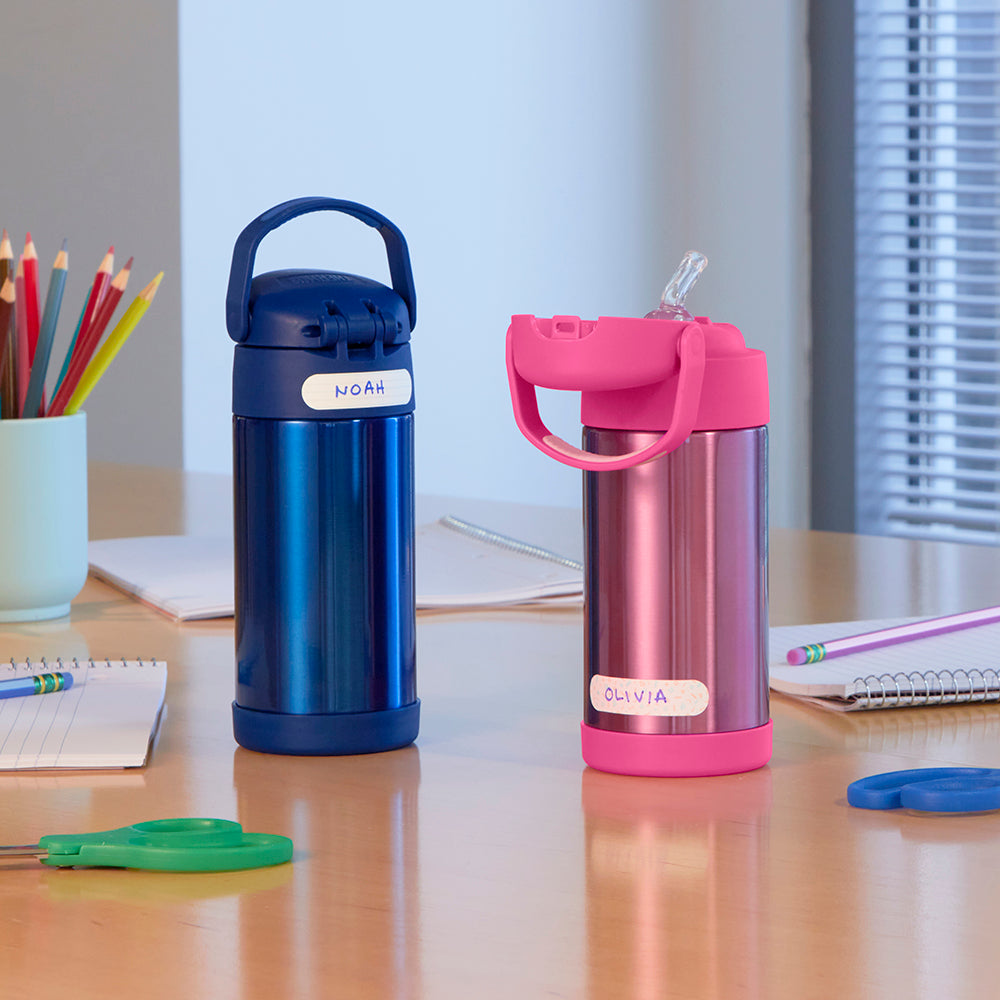 12 ounce blue and pink Funtainer water bottles labeled sitting on a table.